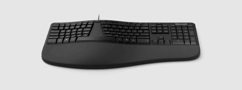Microsoft LXM 00001 split keyboard design that has improved cushioned palm rest and shortcut keys to better prevent carpal tunnel symptoms.