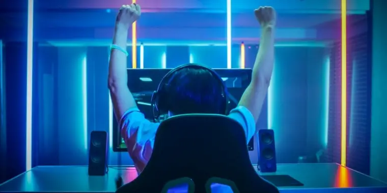 Gamer holding hands up in an act of victory. It's much easier to play games when you have CPU with integrated graphics on board